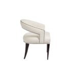 Charles Dining Chair, upholstered in a soft white velvet fabric with a curved backrest, nailhead trim, and tapered dark wood legs.