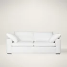 Plush white two-seat sofa with deep cushions, oversized arms, and a minimalist silhouette.