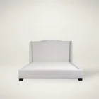 Elegant beige upholstered Layla Bed with curved headboard and minimalist styling.