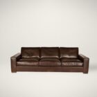 Rich brown leather three-seat sofa with wide arms, low profile, and deep plush cushions.