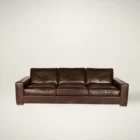 Rich brown leather three-seat sofa with wide arms, low profile, and deep plush cushions.