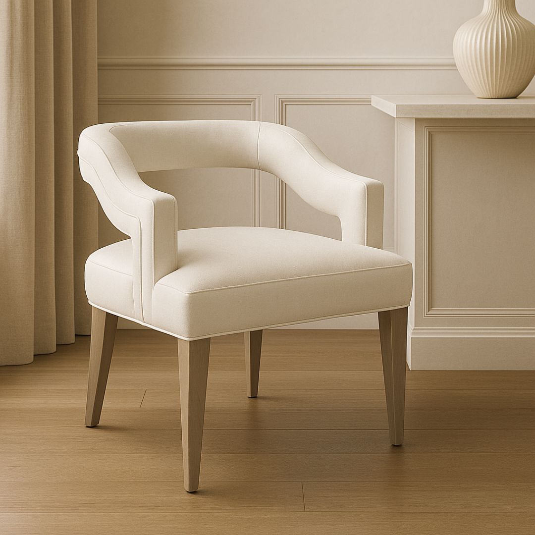 Elegant modern dining armchair with sculpted backrest and plush ivory upholstery, shown in both a lifestyle interior and isolated product view.