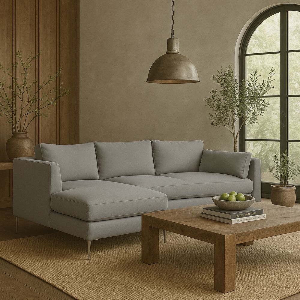 Modern grey sectional sofa with low back, slim arms, and metal tapered legs featuring a left-facing chaise