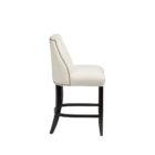 Stool in Cream Fabric with Black Wood Legs, Highlighting Nailhead Trim.