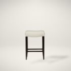 A backless upholstered saddle stool with cream fabric seat, dark espresso wood frame, and footrest support.