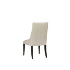 rinity Dining Chair, featuring a vertically channeled backrest, smooth cream upholstery, and tapered dark wood legs.