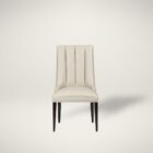 rinity Dining Chair, featuring a vertically channeled backrest, smooth cream upholstery, and tapered dark wood legs.