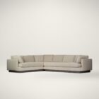 Modern beige sectional sofa with deep seating, clean lines, and a recessed dark wood base.
