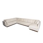 Modern beige sectional sofa with deep seating, clean lines, and a recessed dark wood base.