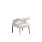 Elegant modern dining armchair with sculpted backrest and plush ivory upholstery, shown in both a lifestyle interior and isolated product view.