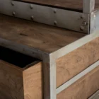 Tall industrial-style shelving unit with metal frame, wood shelves, integrated bottom drawers, and a leaning metal ladder.