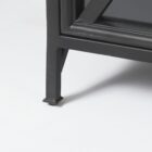 Black metal sideboard with four glass-front doors featuring X-cross detailing and slim tapered legs.