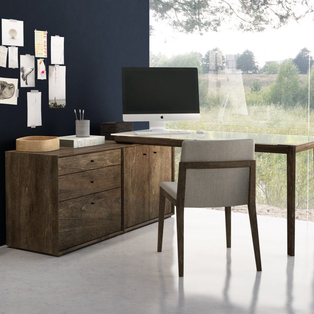 L-shaped modern desk in charcoal wood finish with a floating black surface and integrated storage drawers.