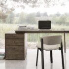 Modern charcoal-stained desk with matte black top and integrated three-drawer pedestal.