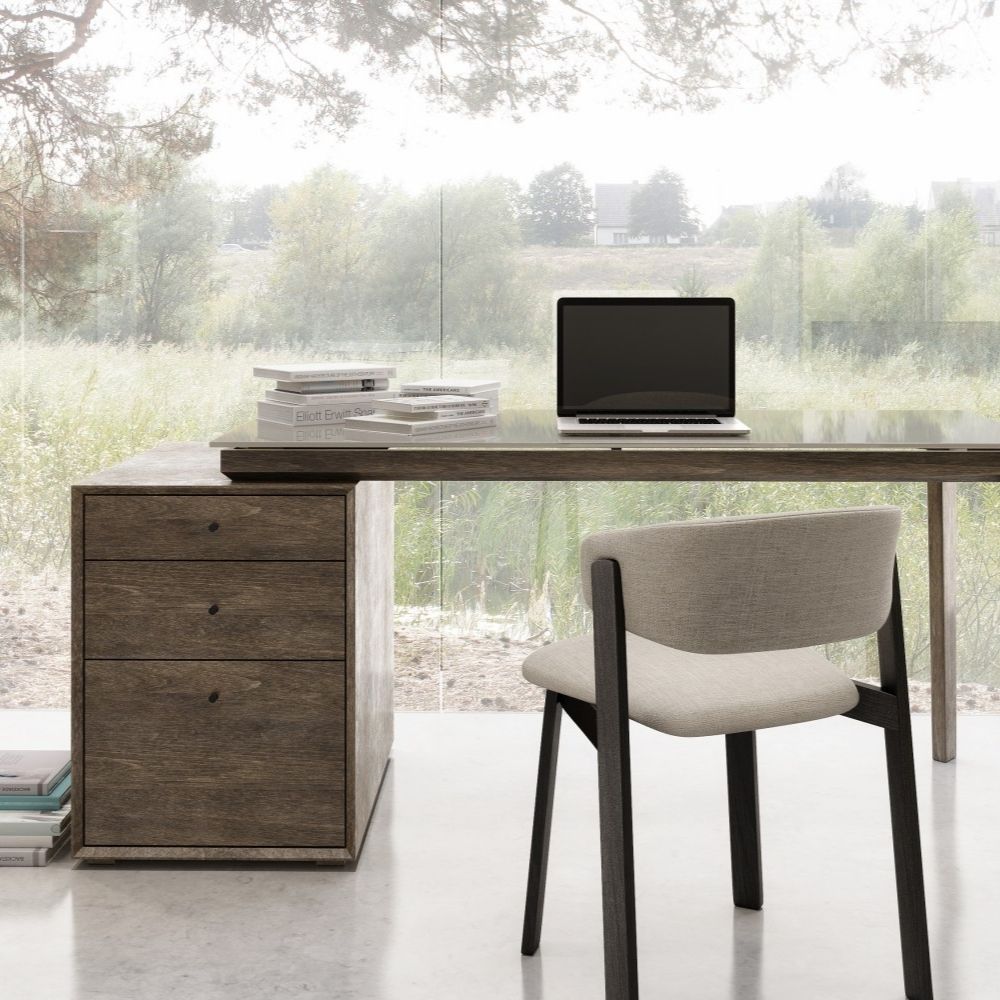 Modern charcoal-stained desk with matte black top and integrated three-drawer pedestal.