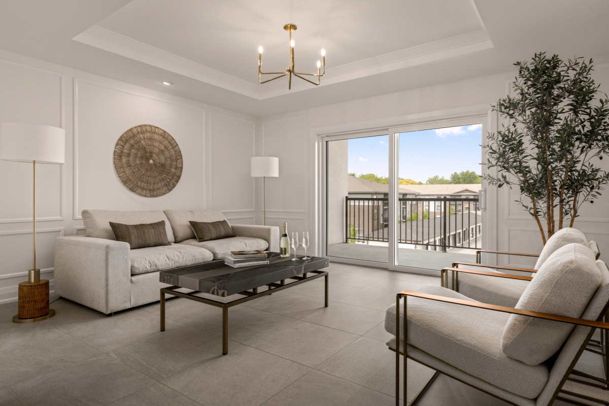 Minimalist living room with light tones, gold accents, and a tall faux olive tree for natural softness.