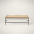 Rectangular rattan tray-style cocktail table with a slim black metal base