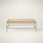 Rectangular rattan tray-style cocktail table with a slim black metal base