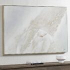 Abstract textured wall art in soft neutral tones with white, cream, and subtle grey hues, featuring raised detailing for depth and dimension.