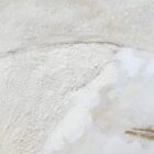 Abstract textured wall art in soft neutral tones with white, cream, and subtle grey hues, featuring raised detailing for depth and dimension.