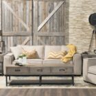 Contemporary deep-seat sofa in earthy olive-brown upholstery with wide arms and four plush back cushions.