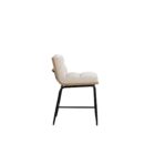 A modern upholstered counter stool with a soft cream fabric seat and backrest, wooden trim, and sleek black metal legs.