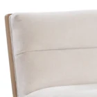 A modern upholstered counter stool with a soft cream fabric seat and backrest, wooden trim, and sleek black metal legs.