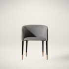 Modern barrel-back dining armchair with charcoal grey fabric seat, faux leather exterior, black tapered legs, and brass metal caps.