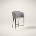 Asher counter stool with upholstered seat and backrest, black tapered legs, and gold foot caps.