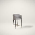 Asher counter stool with upholstered seat and backrest, black tapered legs, and gold foot caps.