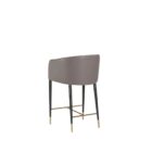 Asher counter stool with upholstered seat and backrest, black tapered legs, and gold foot caps.