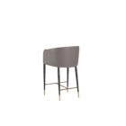 Asher counter stool with upholstered seat and backrest, black tapered legs, and gold foot caps.