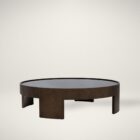 Large round coffee table with dark wood finish and sculptural base design, featuring a recessed top.