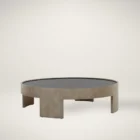 Round coffee table with light wood base and dark recessed top, featuring sculptural curved legs.