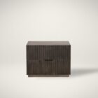 Dark wood nightstand with distinctive vertical fluted drawer fronts and a minimalist rectangular silhouette.