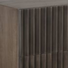 Dark wood nightstand with distinctive vertical fluted drawer fronts and a minimalist rectangular silhouette.