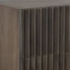 Dark wood nightstand with distinctive vertical fluted drawer fronts and a minimalist rectangular silhouette.