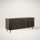Large dark wood sideboard with vertical fluted front detailing and slim black legs, styled in a minimalist aesthetic.