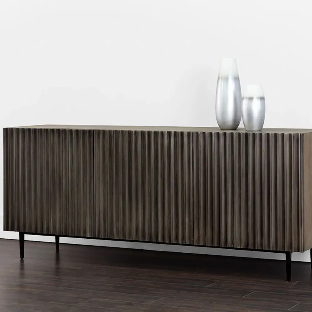 Large dark wood sideboard with vertical fluted front detailing and slim black legs, styled in a minimalist aesthetic.
