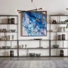 Modern bronze-finished Eiffel bookcase featuring open geometric shelving design.