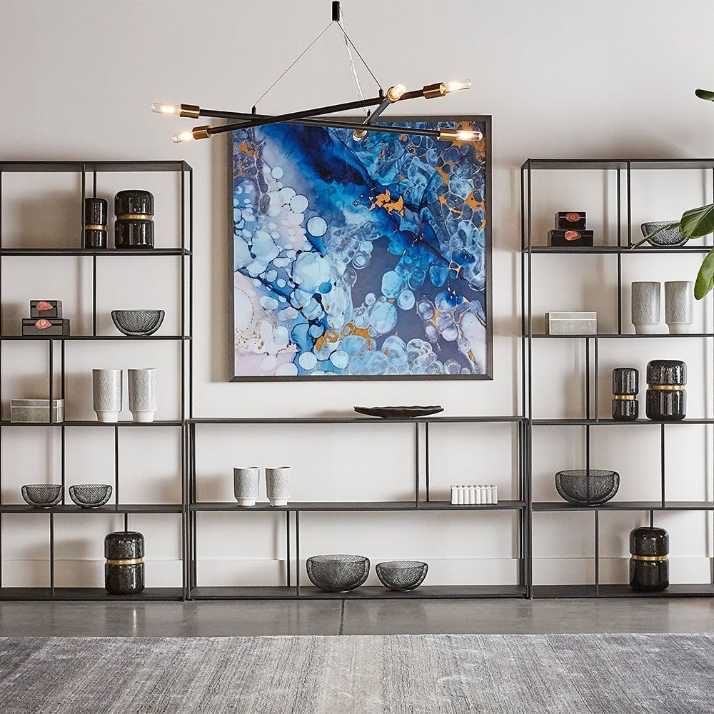Modern bronze-finished Eiffel bookcase featuring open geometric shelving design.