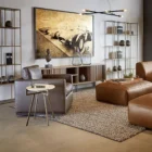 Modern bronze-finished Eiffel bookcase featuring open geometric shelving design.