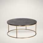 Round coffee table with a textured charcoal top and gold-finished metal base