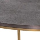 Round coffee table with a textured charcoal top and gold-finished metal base