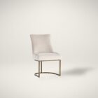 Elegant stool with soft beige upholstered seat and curved gold metal base.