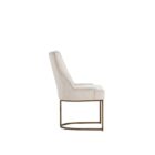 Elegant stool with soft beige upholstered seat and curved gold metal base.