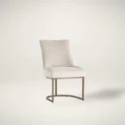 Elegant stool with soft beige upholstered seat and curved gold metal base.