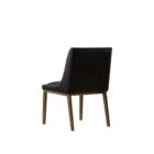Black leather dining chair with vertical channel stitching, arched backrest, and slim brass-toned legs.