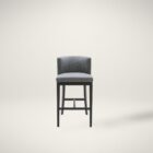 Dark grey upholstered barstool with low backrest and black wooden legs, styled beside a light wood countertop in a neutral-toned interior.