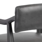 A modern barstool with black wood frame, dark leather upholstery, and a low backrest.